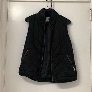 Black vest with gold zipper